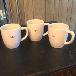 3 Rae Dunn mugs with small writing